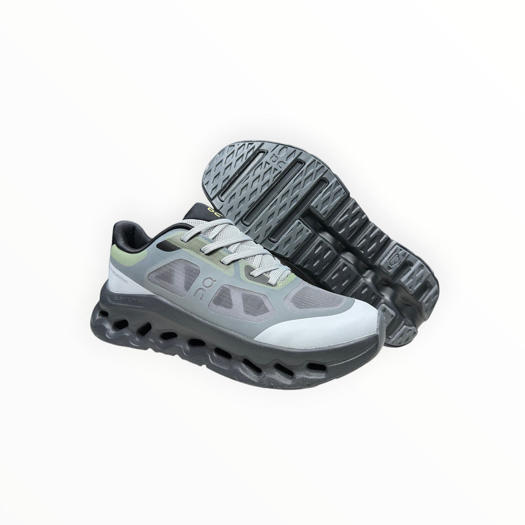 EWW Sports Shoes On Cloudtilt Remix grey and black running shoes with see-through x-ray effect upper and chunky sole.