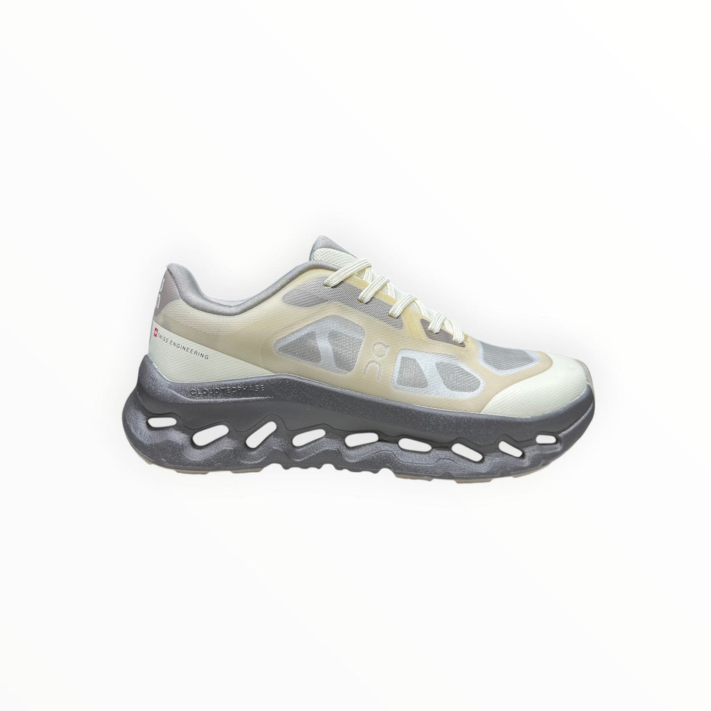 EWW Sports Shoes On Cloudtilt Remix grey and yellow running shoes with see-through x-ray effect upper and chunky grey sole.