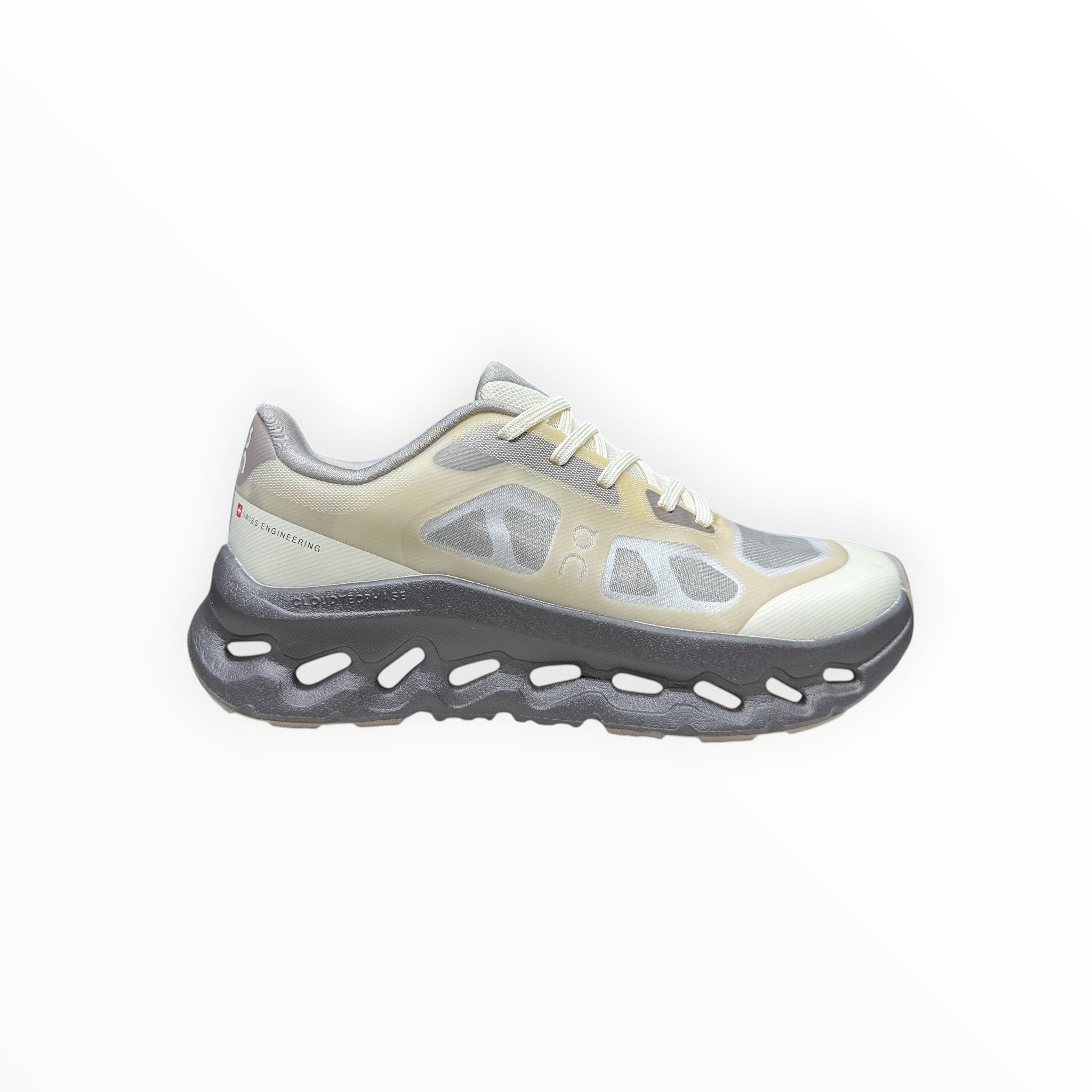 EWW Sports Shoes On Cloudtilt Remix grey and yellow running shoes with see-through x-ray effect upper and chunky grey sole.