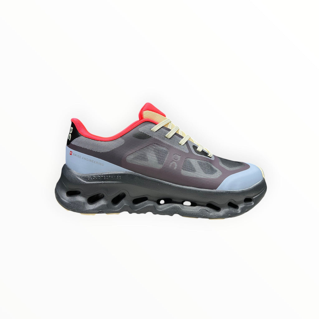 EWW Sports Shoes On Cloudtilt Remix black and light blue running shoe with layered see-through upper and chunky black sole.