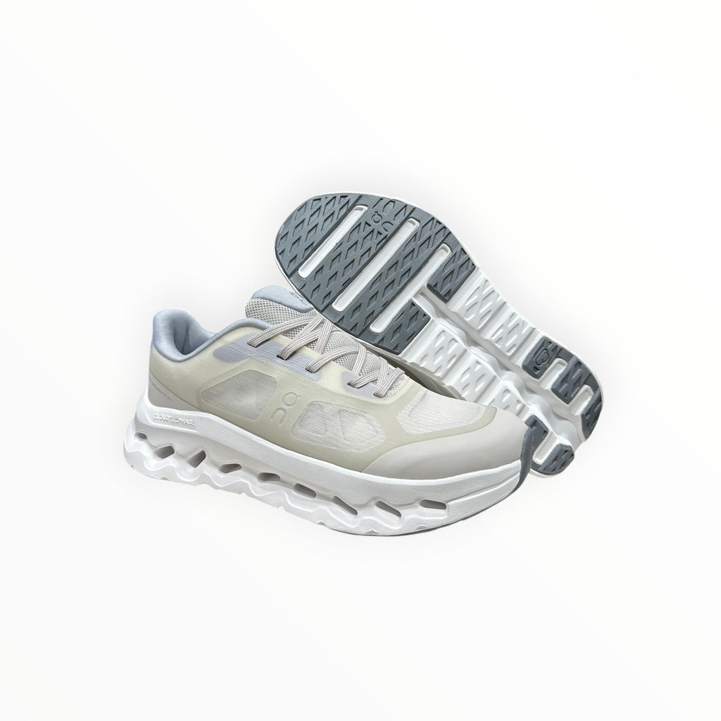 EWW Sports Shoes On Cloudtilt Remix cream running shoes with layered see-through upper and white chunky sole.