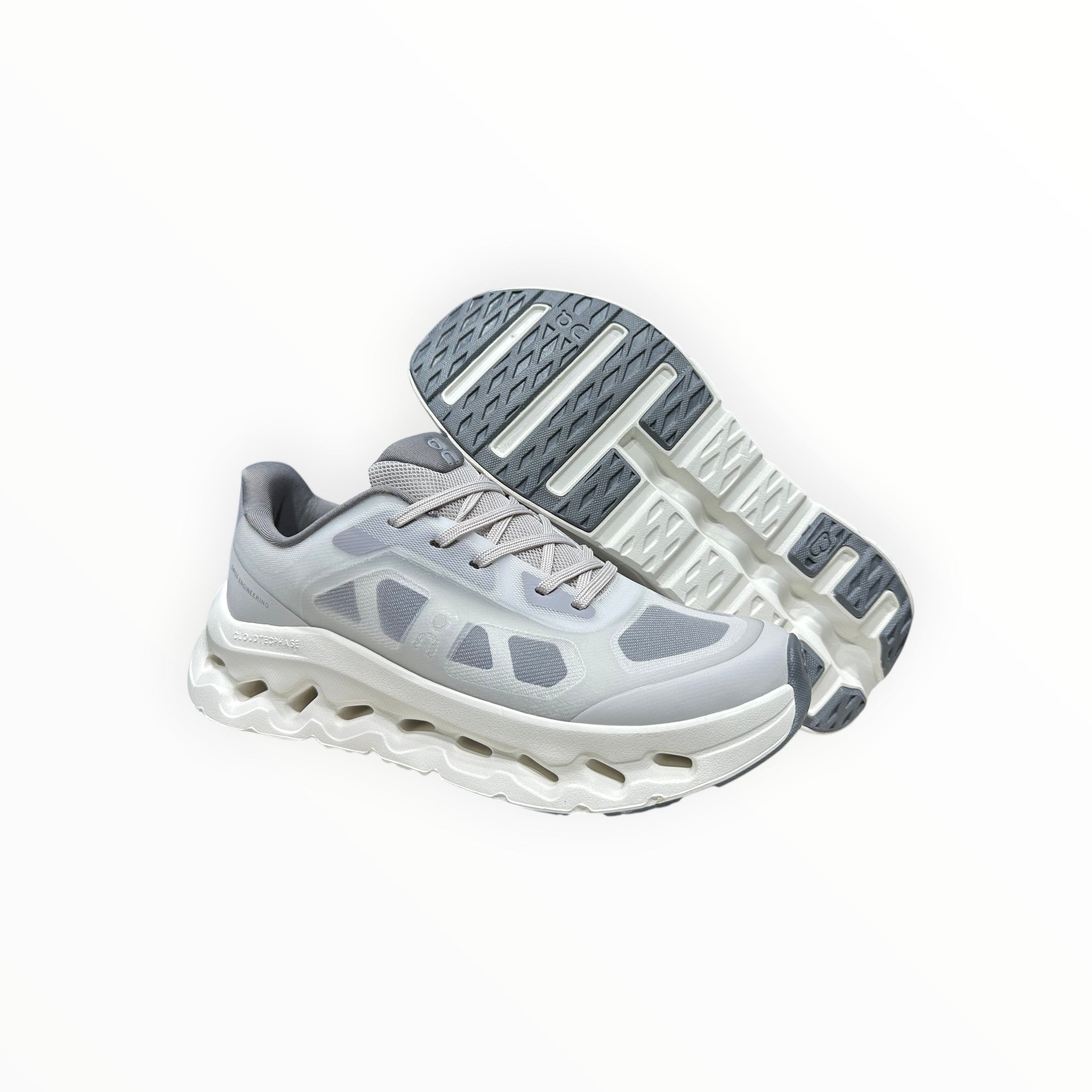 EWW Sports Shoes On Cloudtilt Remix grey running shoes with layered see-through upper and CloudTec Phase cushioning.