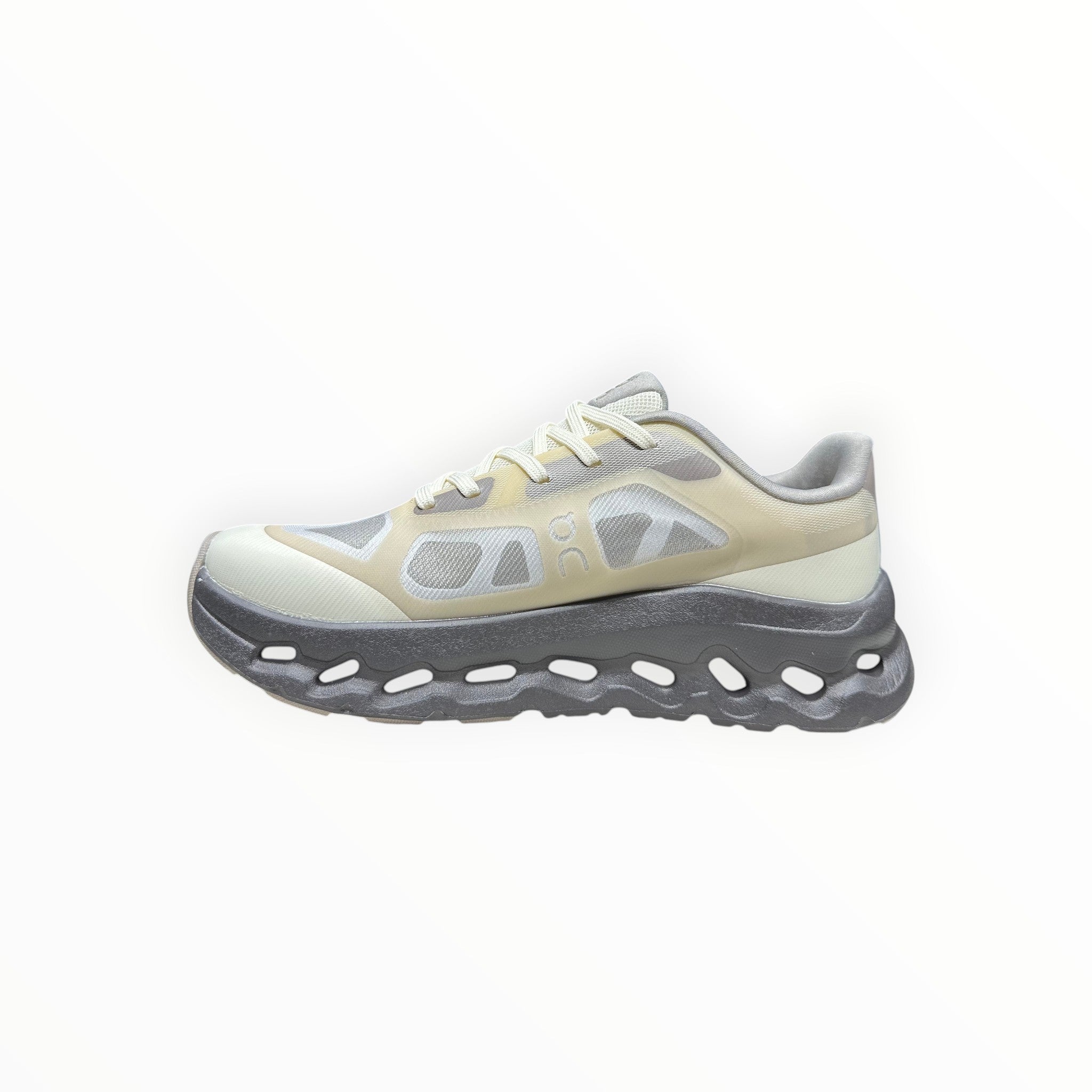 EWW Sports Shoes On Cloudtilt Remix grey and yellow running shoes with see-through upper and chunky grey sole.