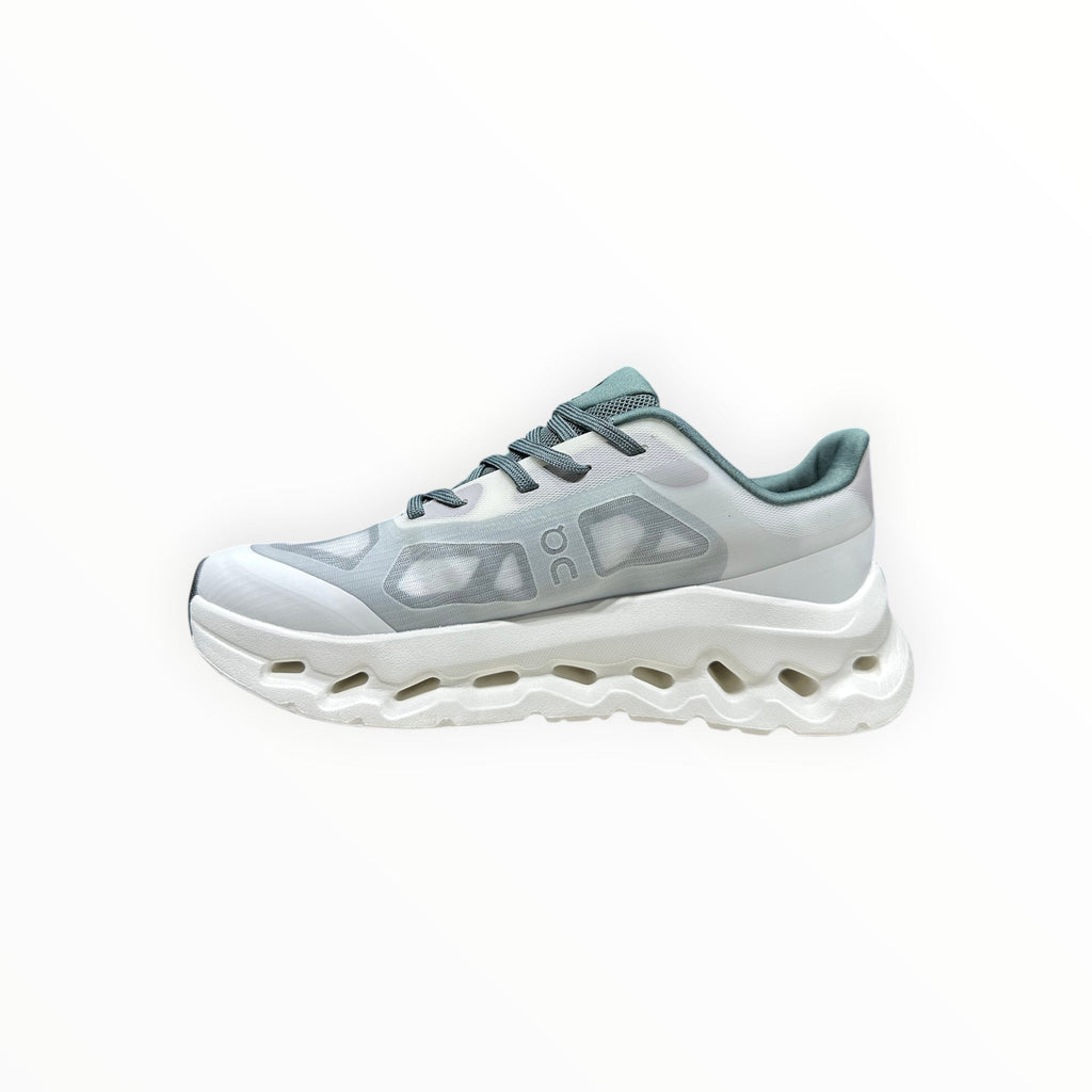 EWW Sports Shoes On Cloudtilt Remix white and light blue running shoes with a translucent layered upper and chunky white sole.