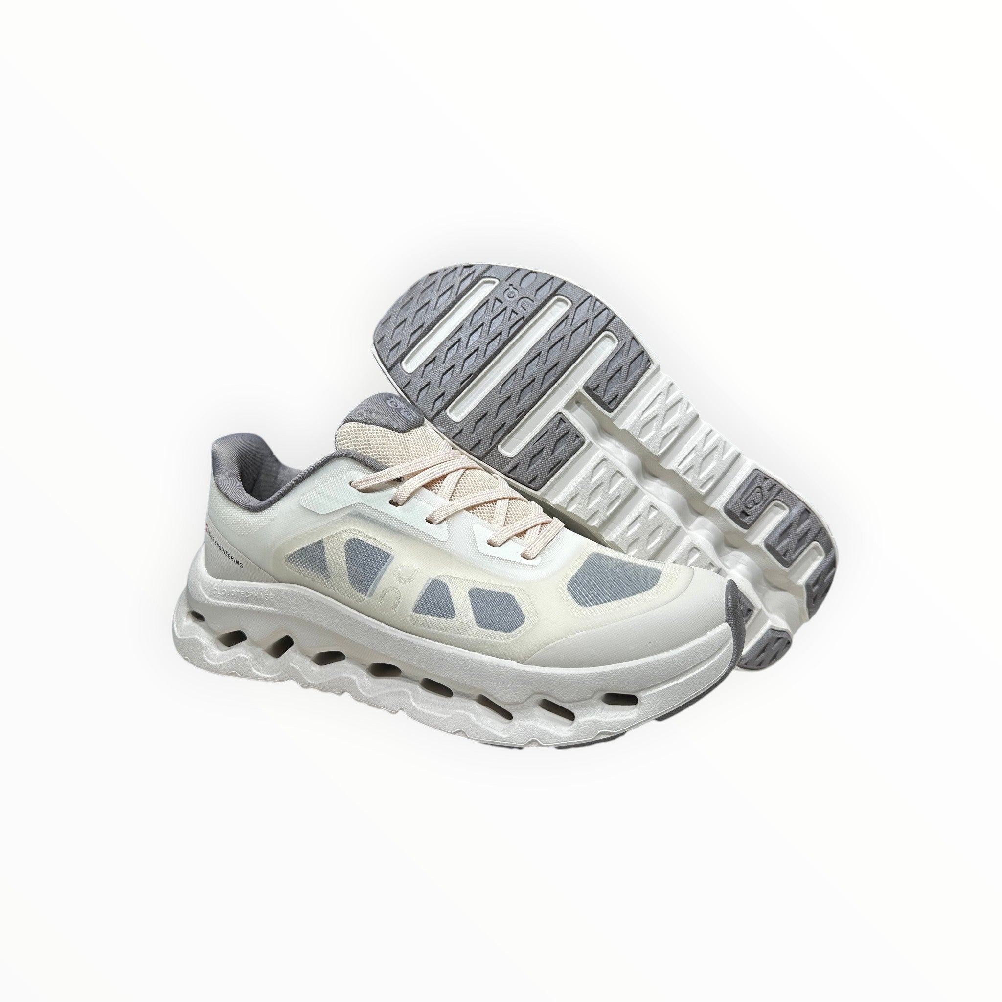 EWW Sports Shoes On Cloudtilt Remix white and grey running shoes with see-through x-ray effect upper and CloudTec Phase cushioning.