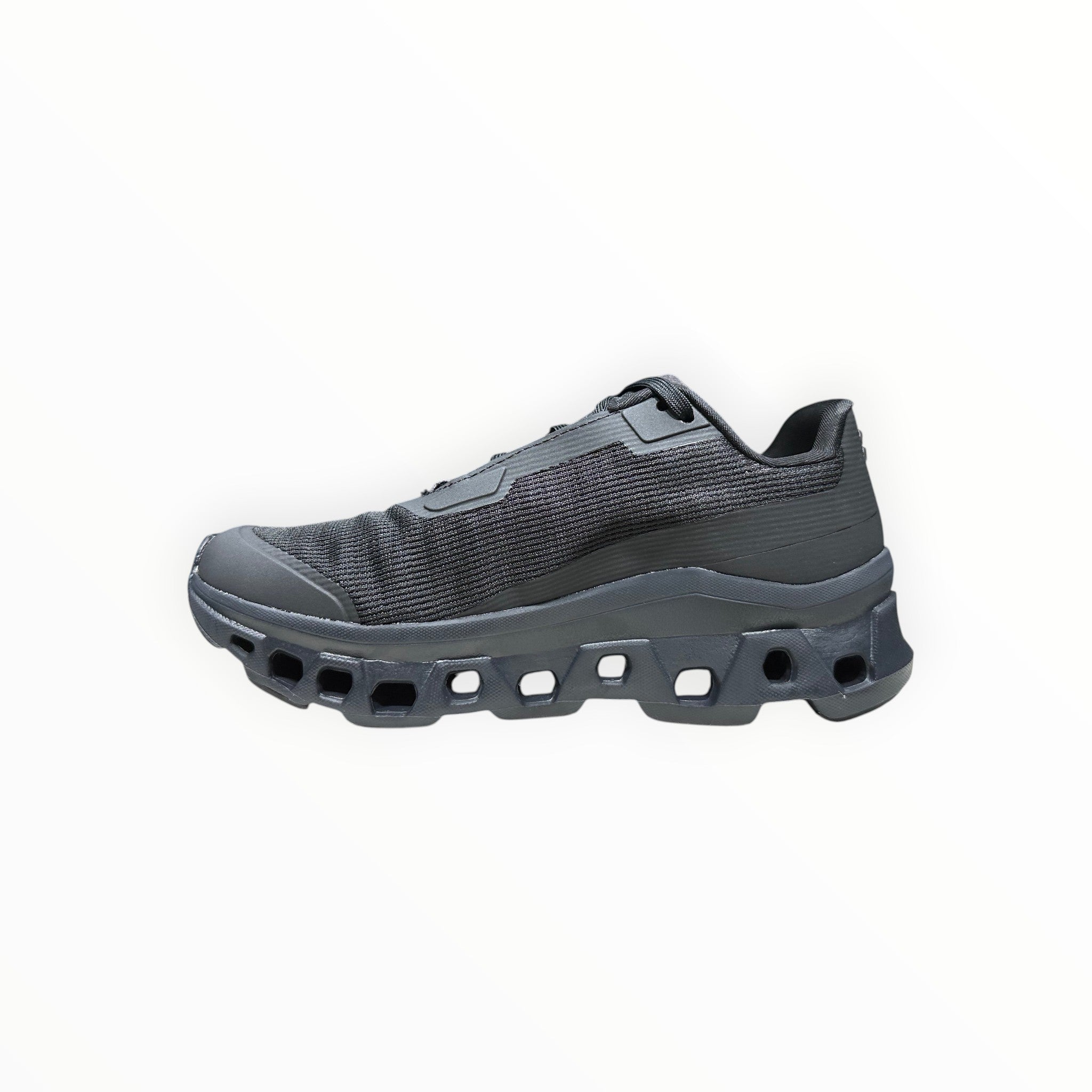 EWW Sports Shoes On Running Cloudmonster Void black running shoe with breathable mesh upper and signature CloudTec cushioning.